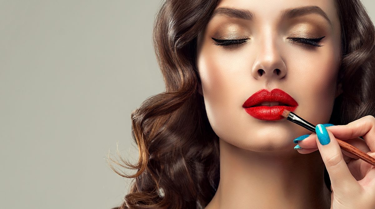 Makeup,Artist,Applies,Red,Lipstick,.,Beautiful,Woman,Face.,Hand