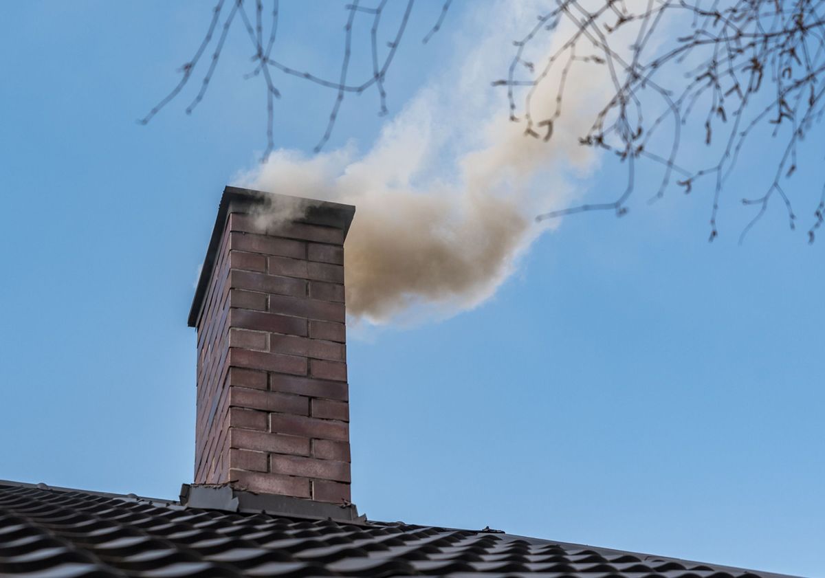 Chimney,On,The,Roof,Of,A,Detached,House.,The,Smoke